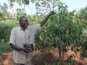 Farmer Mutonyi form Rumukia with his radio which he listens for coffee programs